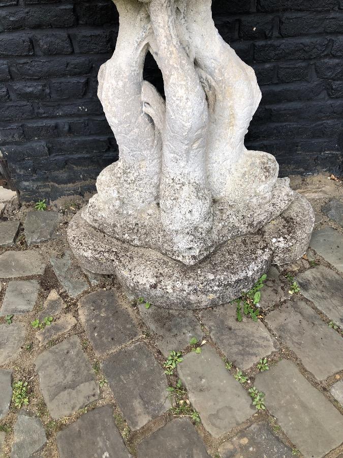 Old fountain with bronz putti on concrete base.