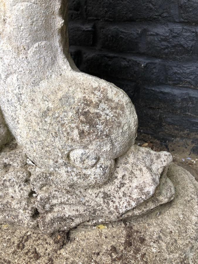 Old fountain with bronz putti on concrete base.