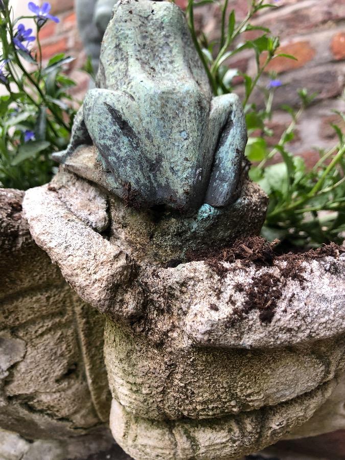 Old fountain with bronz putti on concrete base.